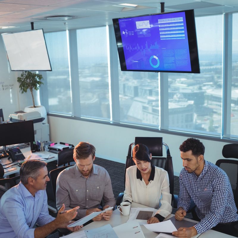 Business partners discussing in meeting at office desk